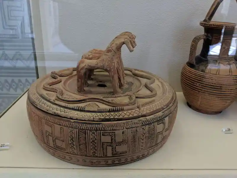 Geometric pyxis with horse and snake design